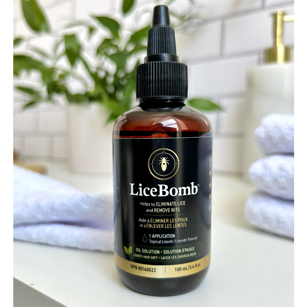 A bottle of LiceBomb hair lice solution, 100 ml, lice treatment kit, nit comb and hair cap included